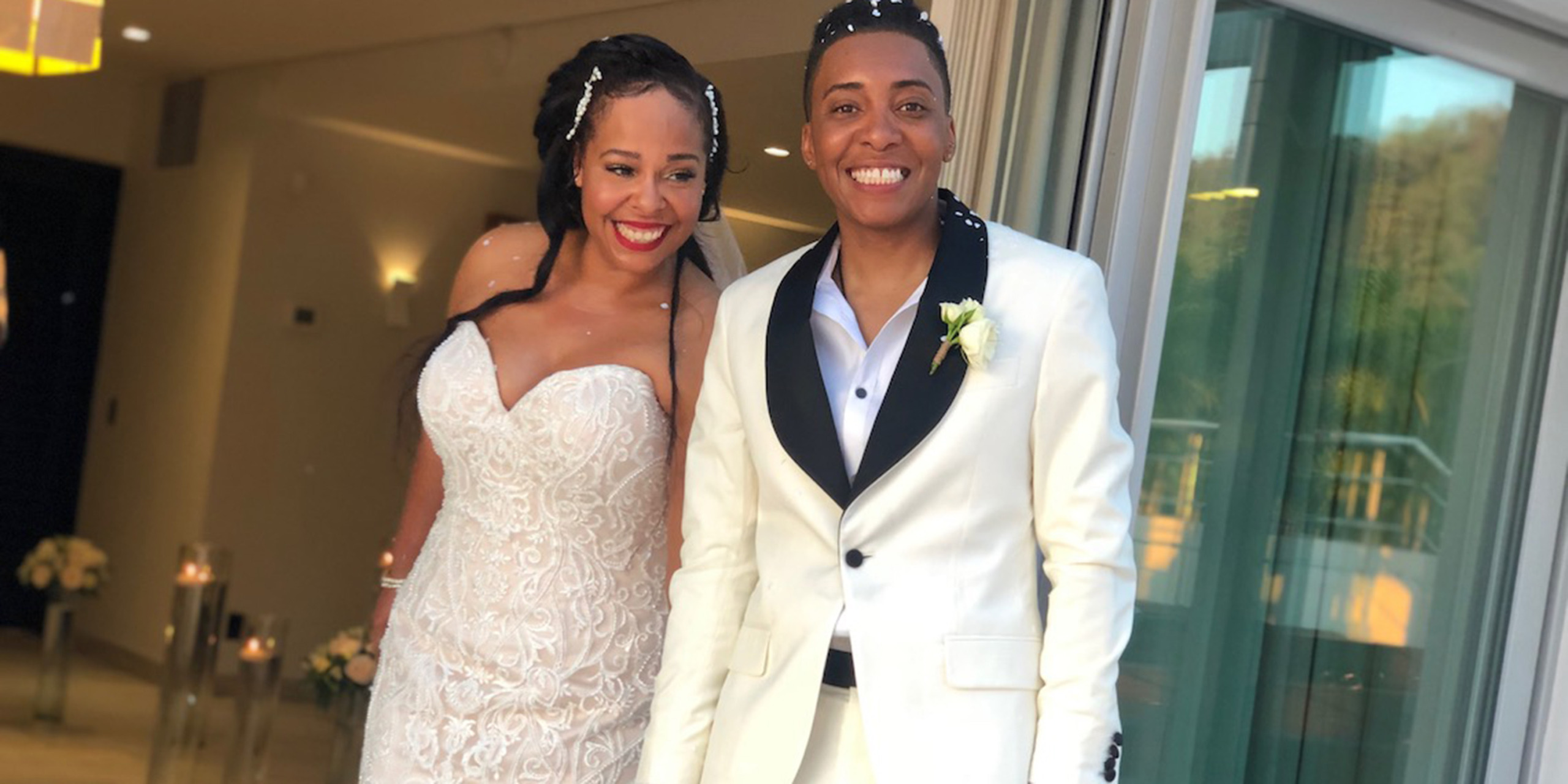 Tramaine and Shannon smile and pose on their wedding day.