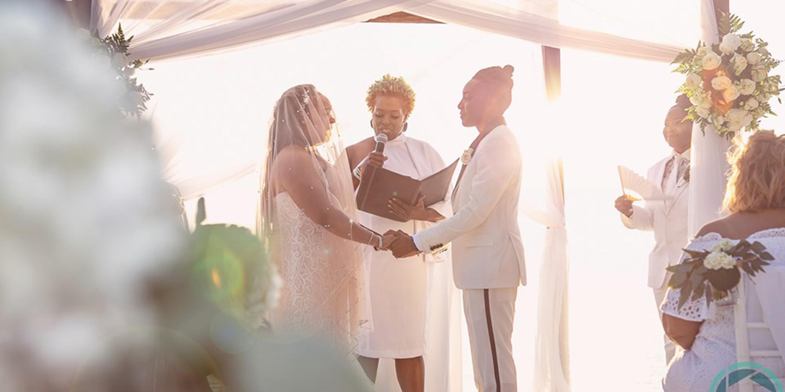 Tramaine and Shannon being married by wedding officiant
