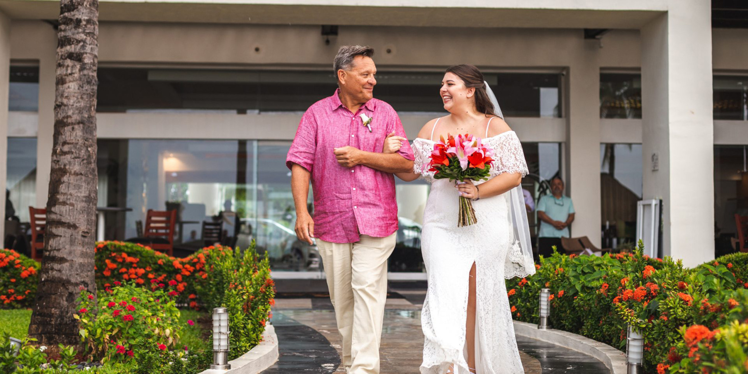 Newlyweds Waylon and Megan walk together after the wedding
