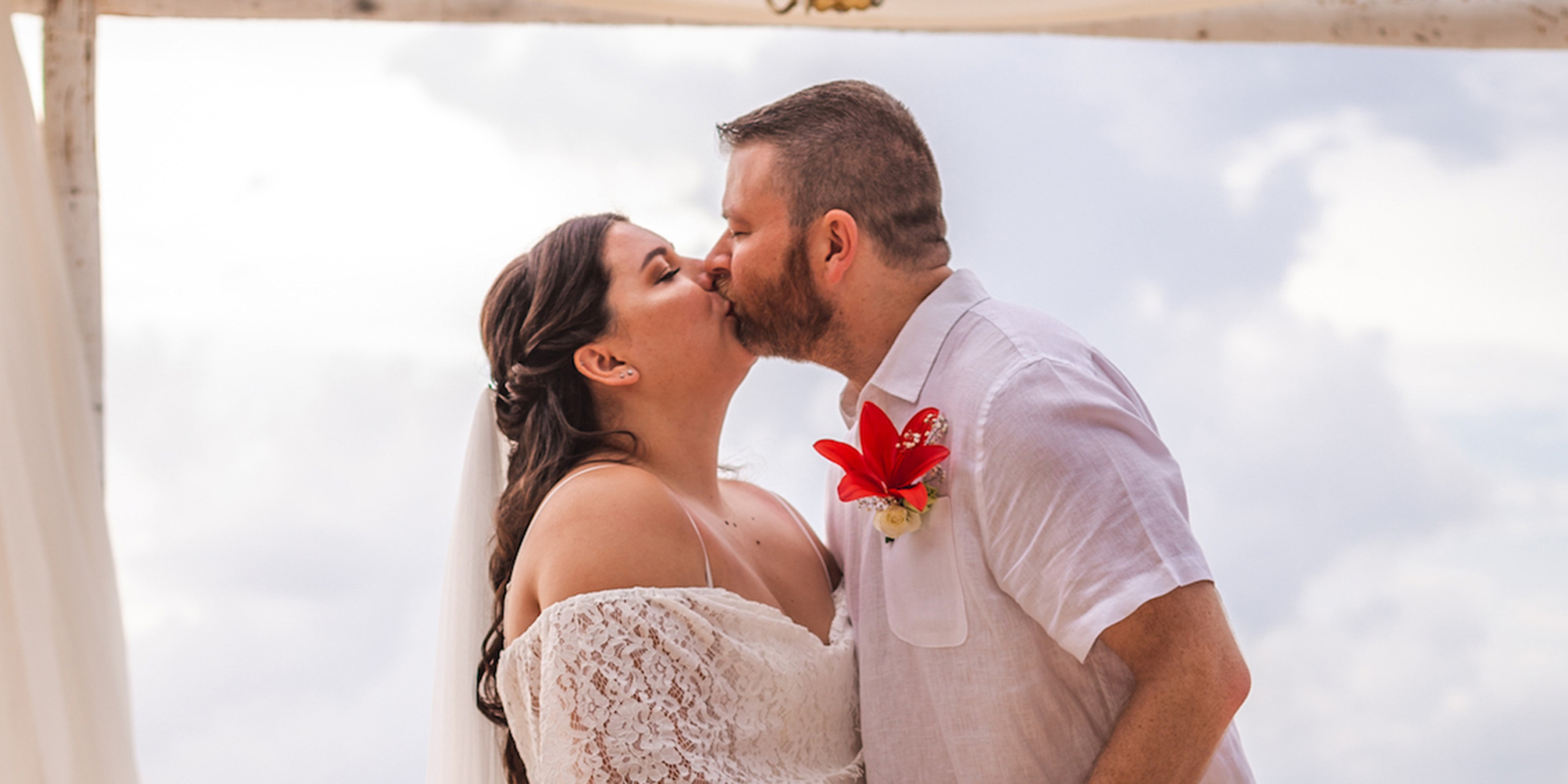 Waylon kisses the bride, Megan at the Destify destination wedding of Waylon and Megan