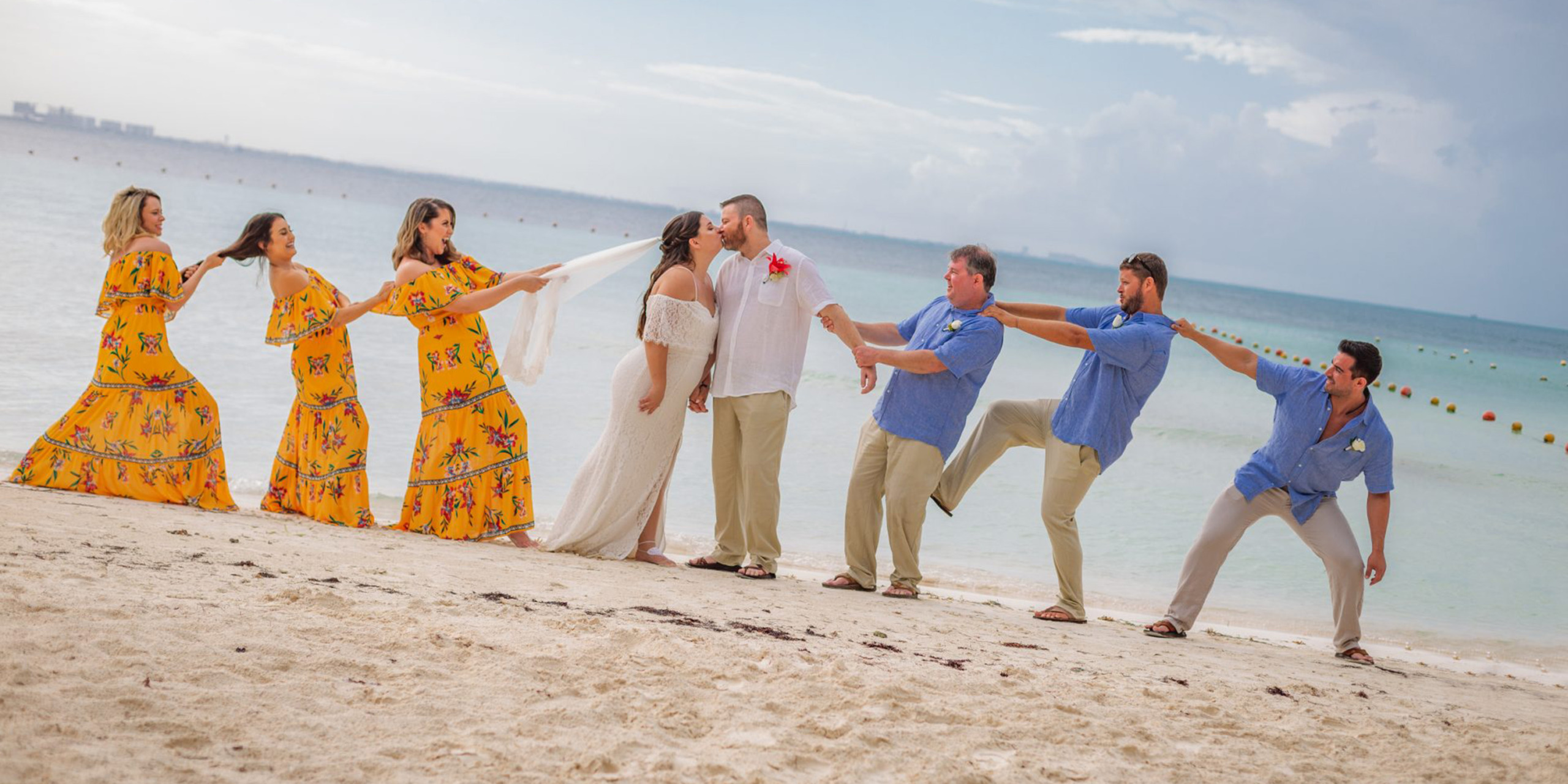 Waylon and Megan silly funny pose with their bridesmaids and groomsmen