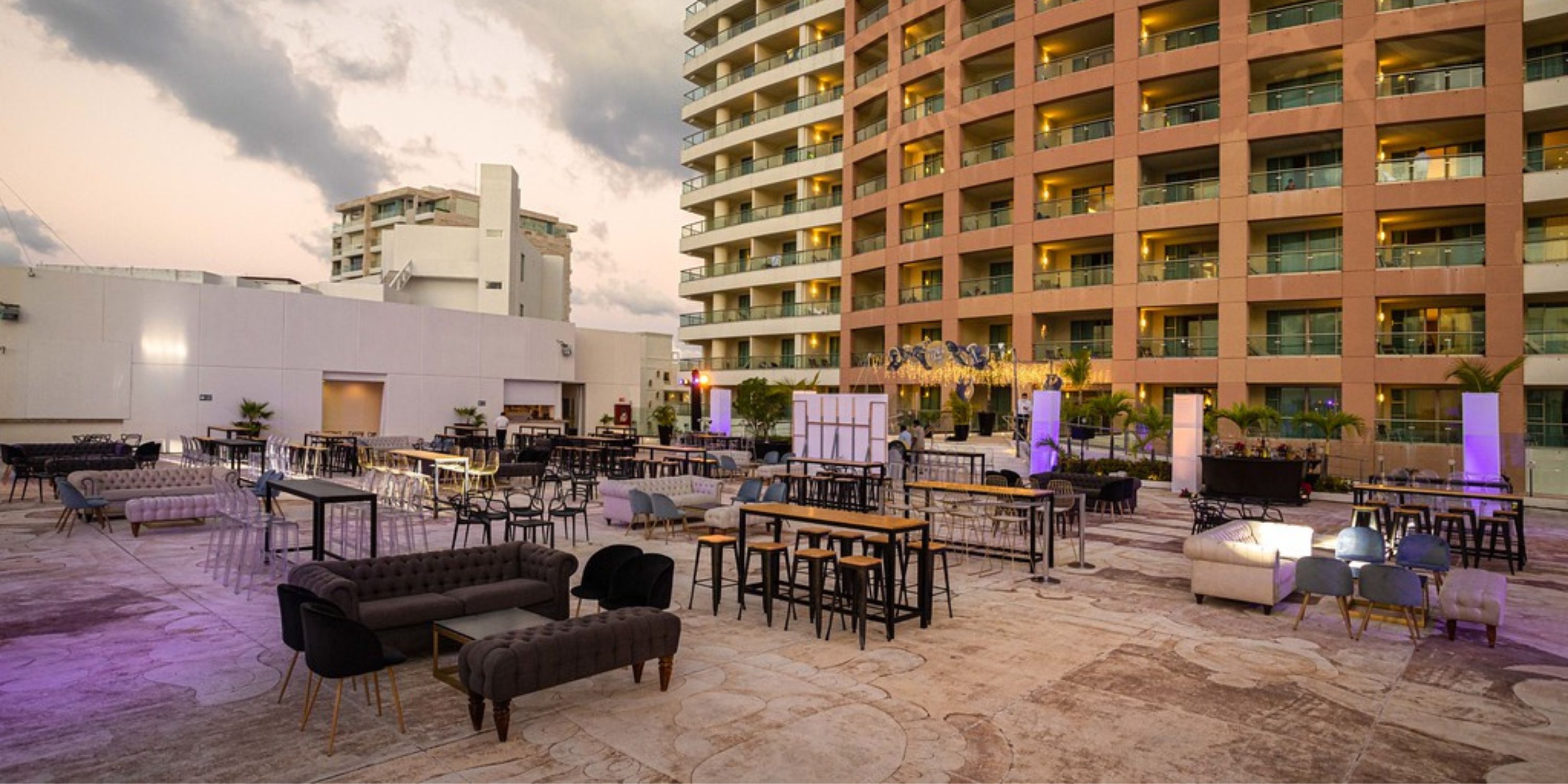 Beach Palace Cancun’s outdoor patio, perfect for a destination wedding, offers varied seating by the hotel.