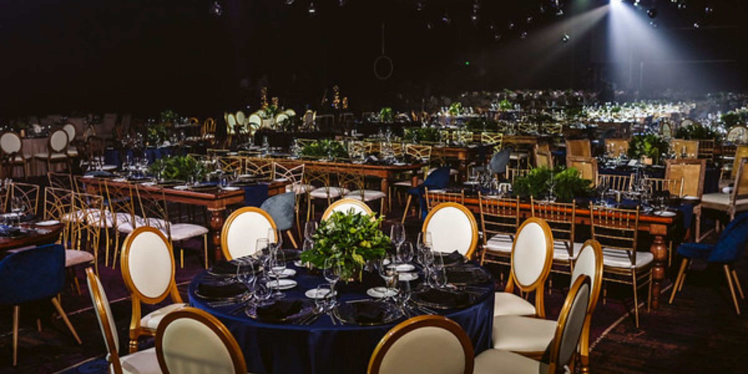 Moon Palace The Grand banquet hall decorated with greenery and set for a stunning destination wedding.