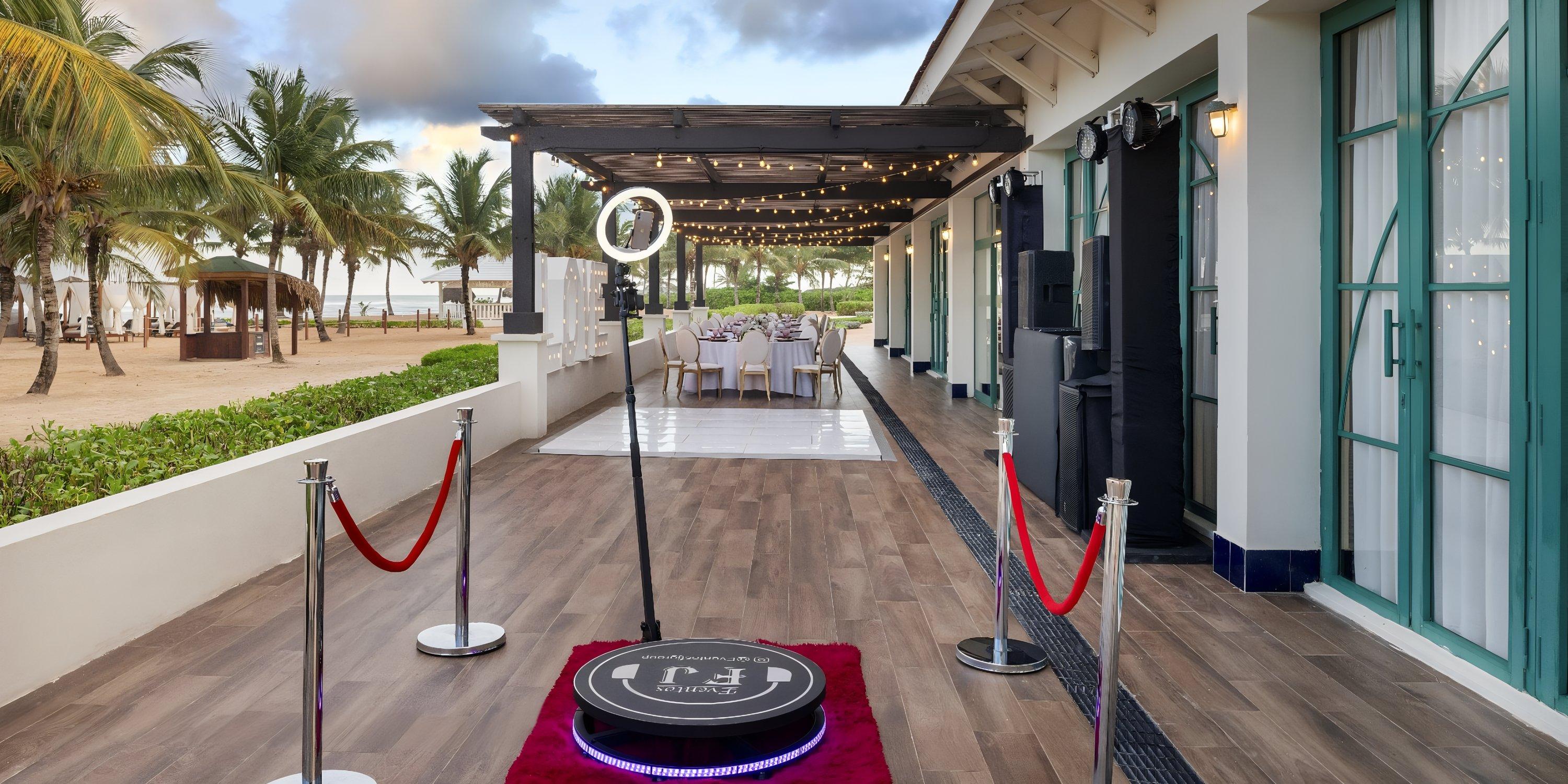 Ocean El Faro’s photo booth, red ropes, and decorated tables create a dreamy destination wedding vibe.