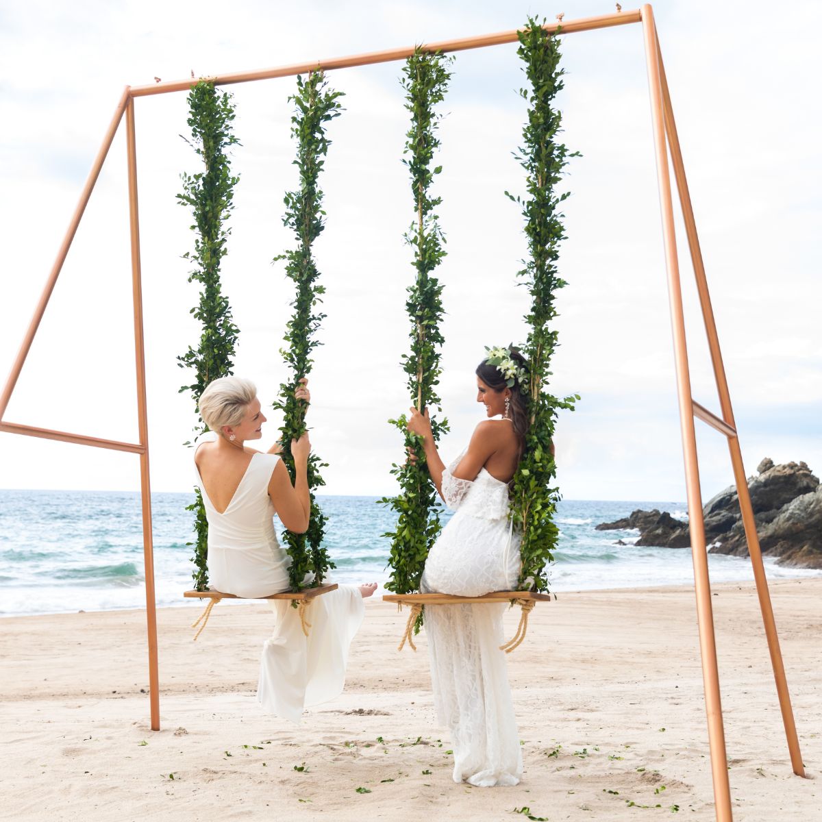 hyatt ziva puerto vallarta LGBTQ+ couple on swings beach venue weekday destination weddings