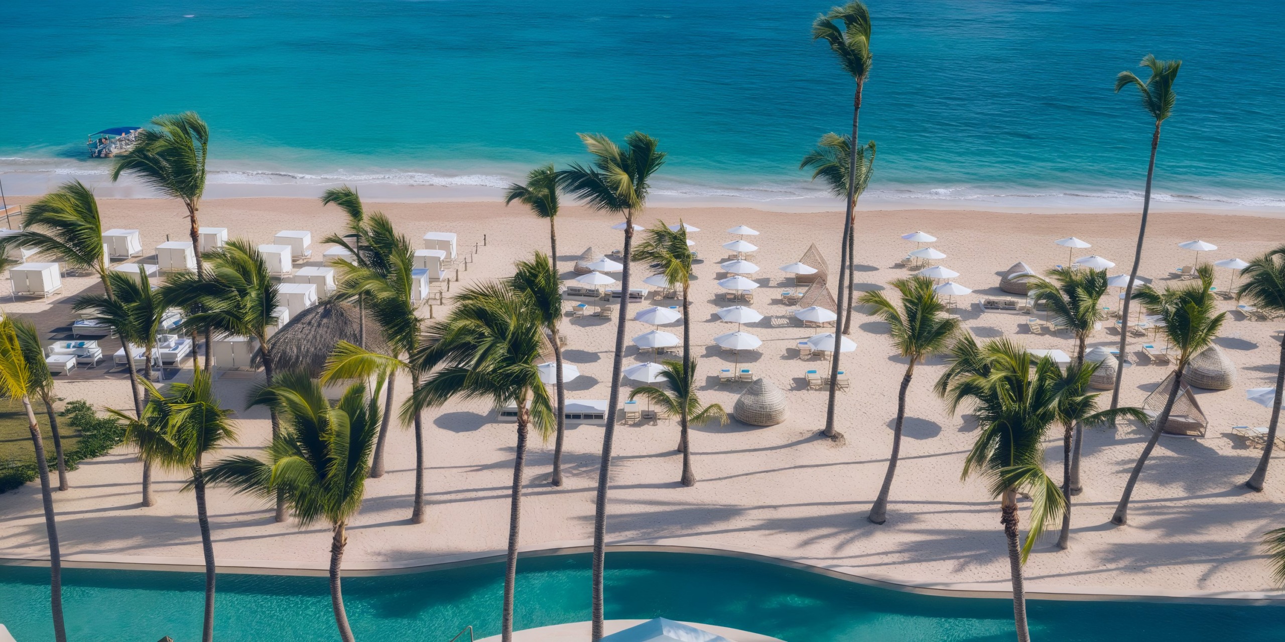 Experience a tropical beach view at Coral Level at Iberostar Selection Bavaro, featuring palm trees, cabanas, and umbrellas on a sandy shore near the turquoise ocean.