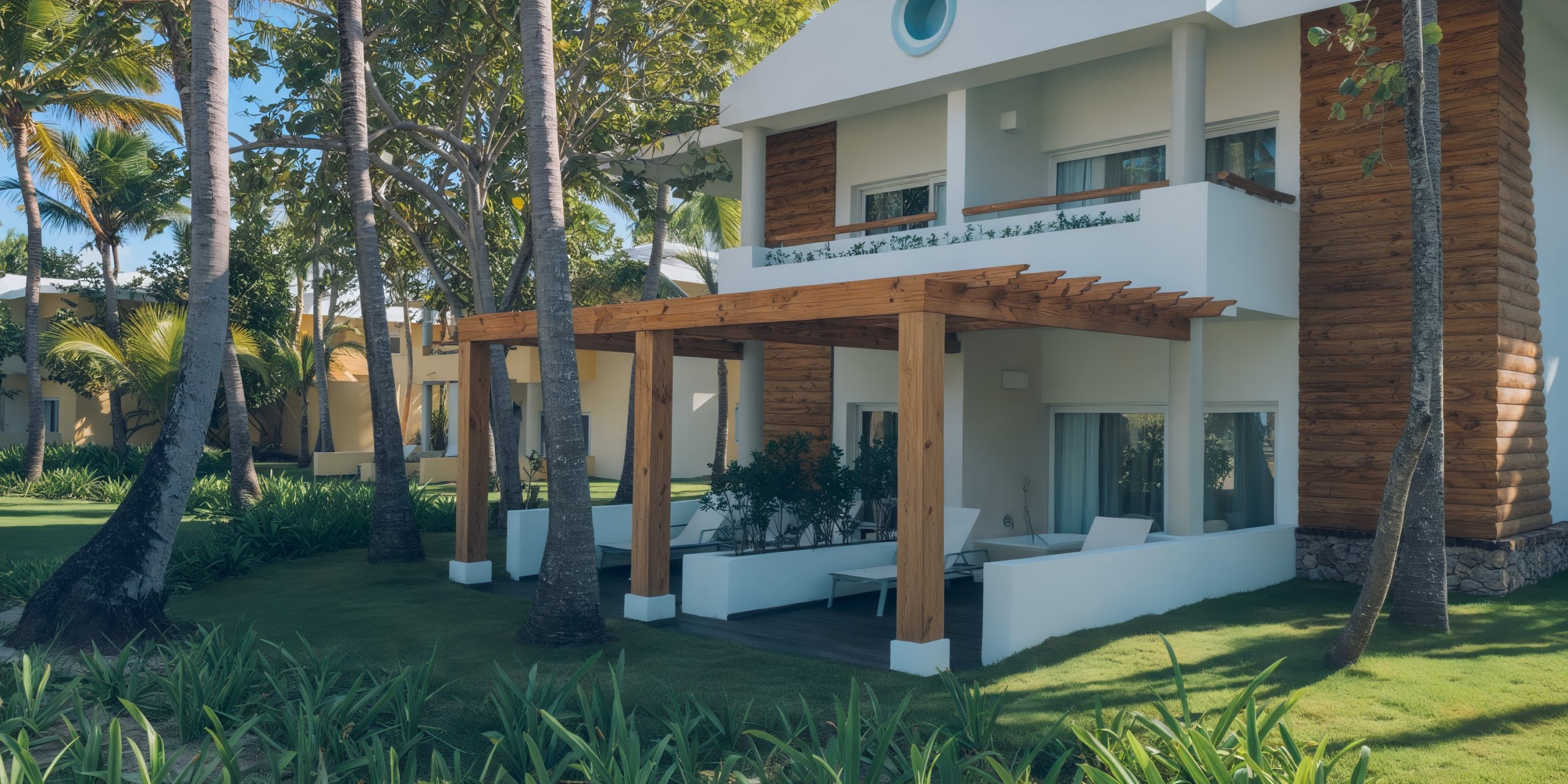 The Coral Level at Iberostar Selection Bavaro is a modern two-story building featuring a wooden pergola, surrounded by lush palm trees and greenery.