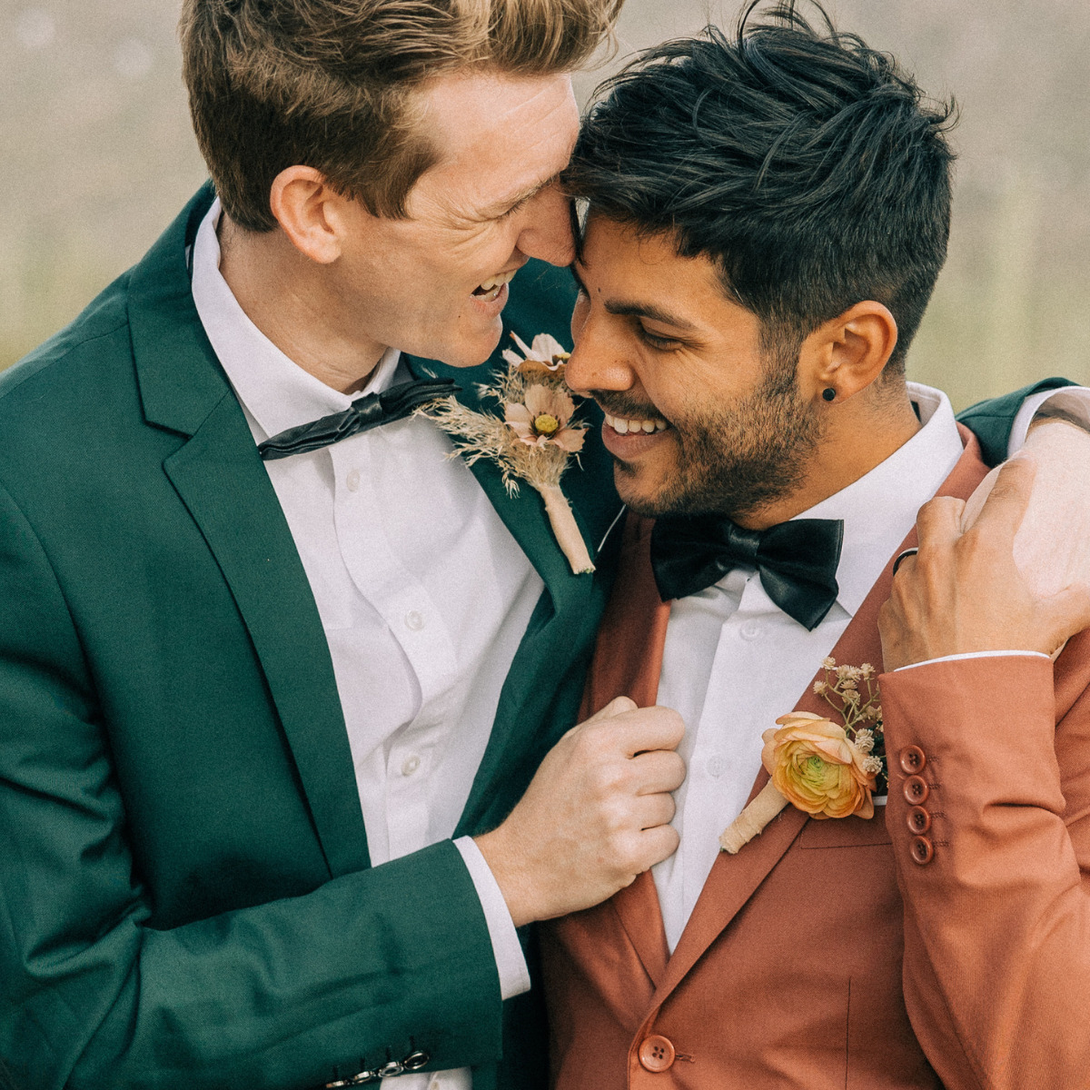 Beautiful gay couple after their destination wedding at one of the best Cancun wedding resorts