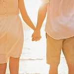 Couple holding their hands after a destination wedding