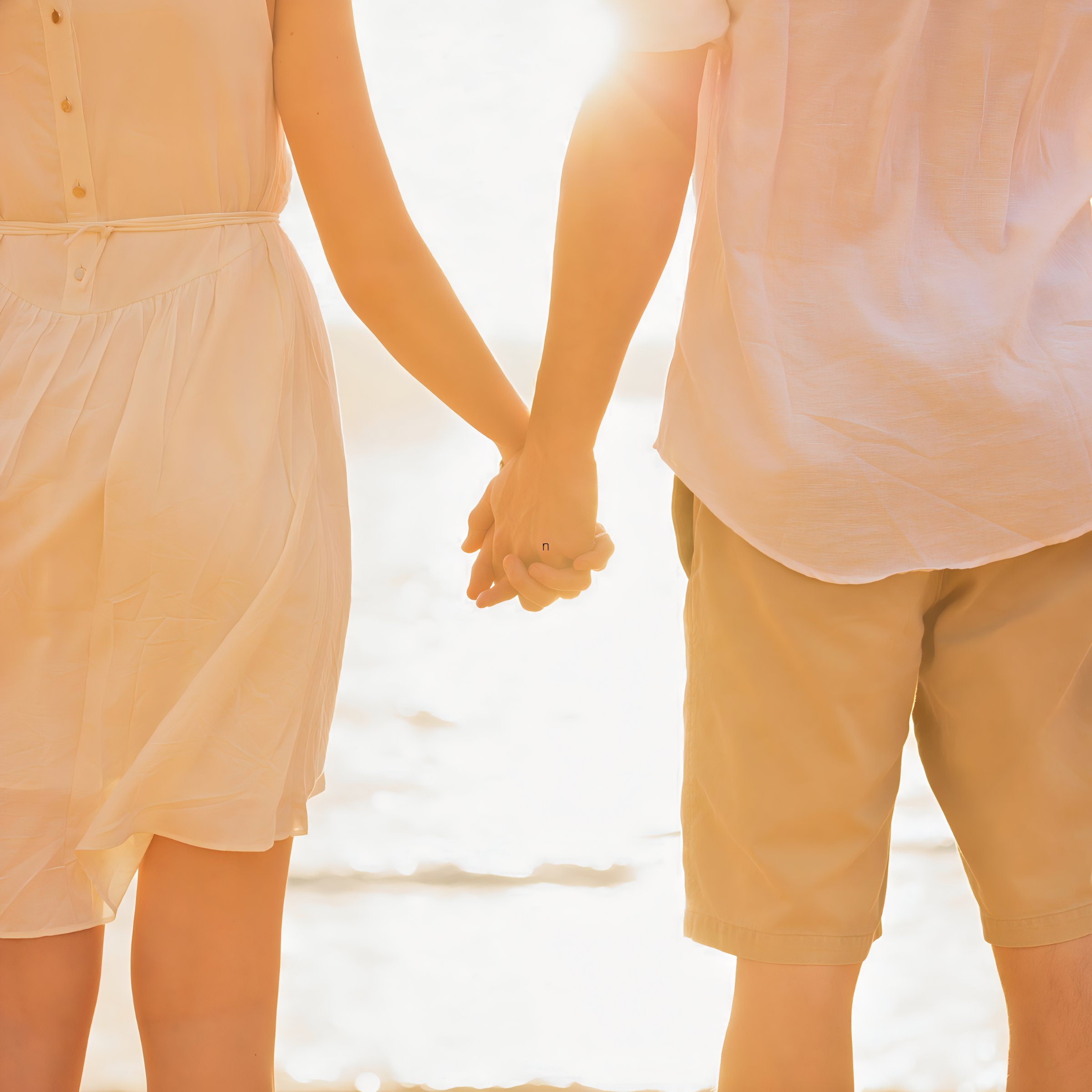 Couple holding their hands after a destination wedding