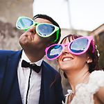 Newly married couple with oversized sunglasses on, a Non Traditional Destination Wedding Ideas
