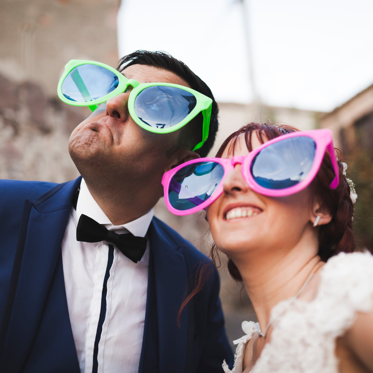 Newly married couple with oversized sunglasses on, a Non Traditional Destination Wedding Ideas