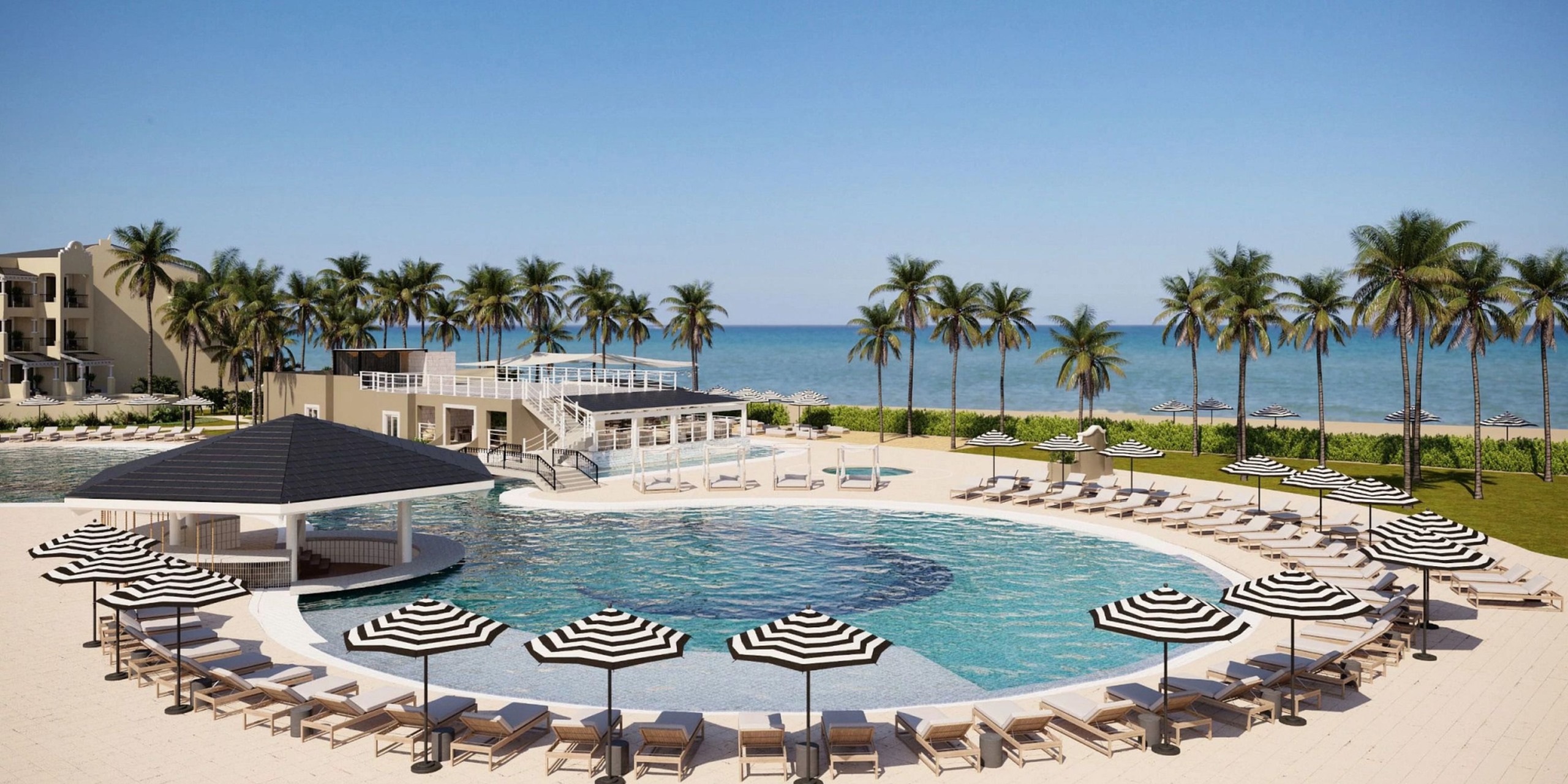 At the Hyatt Zilara Riviera Maya, there is a circular pool adorned with black and white umbrellas and lounge chairs, nestled among palm trees, with the ocean serving as a stunning backdrop.
