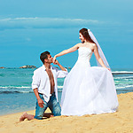 A couple on the beach after their gorgeous ceremony with a destination wedding package under $5,000
