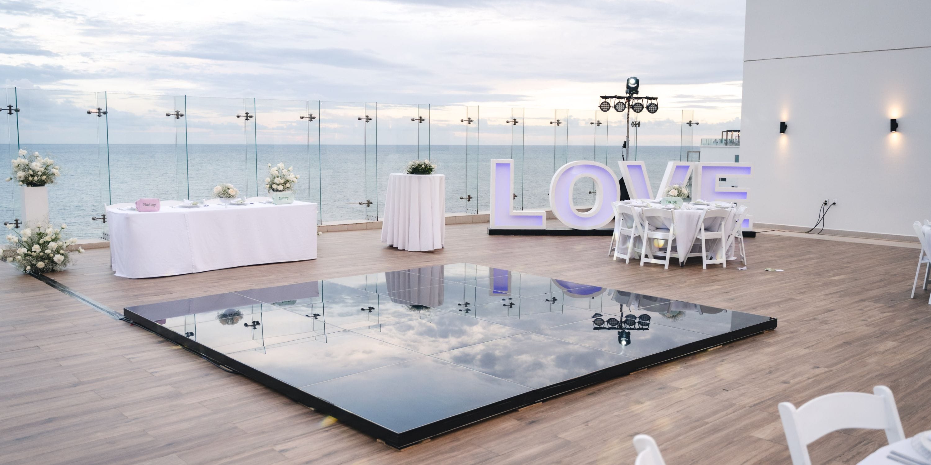 Royalton Splash Riviera Cancun: destination wedding venue with dance floor, LOVE sign, and ocean view.