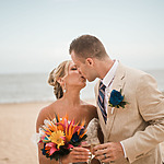 Couple kissing on the beach, best places to have weddings