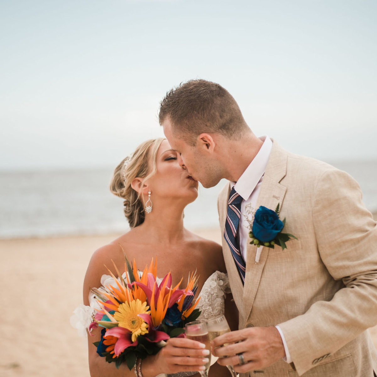 Couple kissing on the beach, best places to have weddings