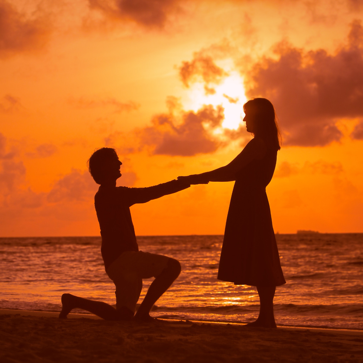 A couple on a beach after their destination wedding that had 30 Destination Wedding Favors