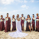 A beautiful bride and wedding party after their wedding vacation
