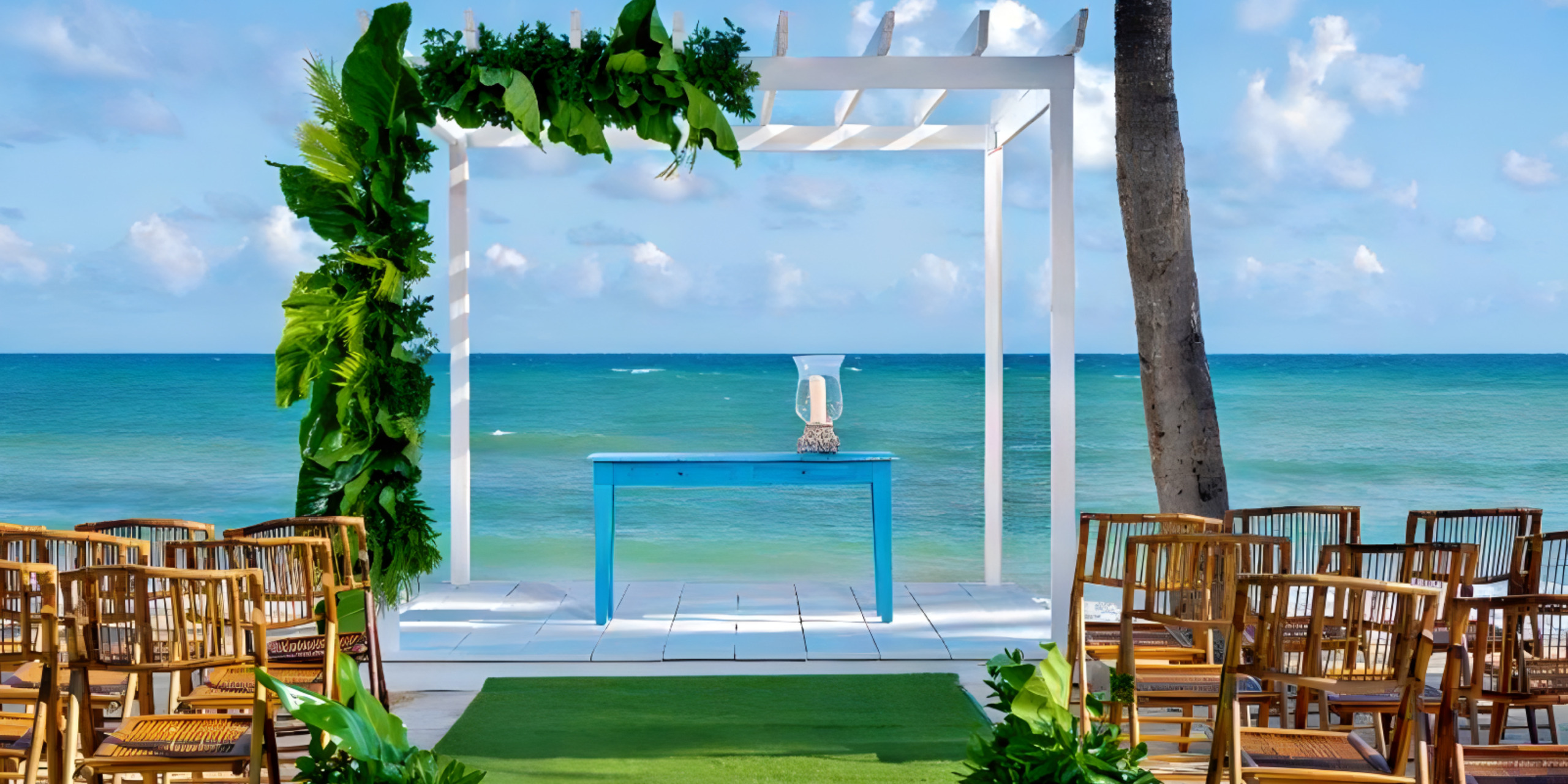 A destination wedding ceremony set up on the beach.