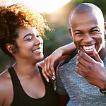 A man and a woman smiling at each other at their destination wedding.