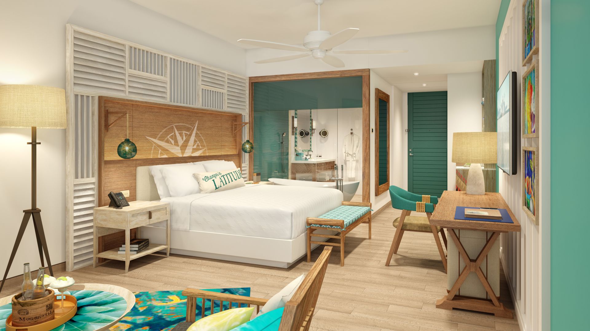 A Margaritaville Beach Resort Riviera Maya room with a bed and a desk.