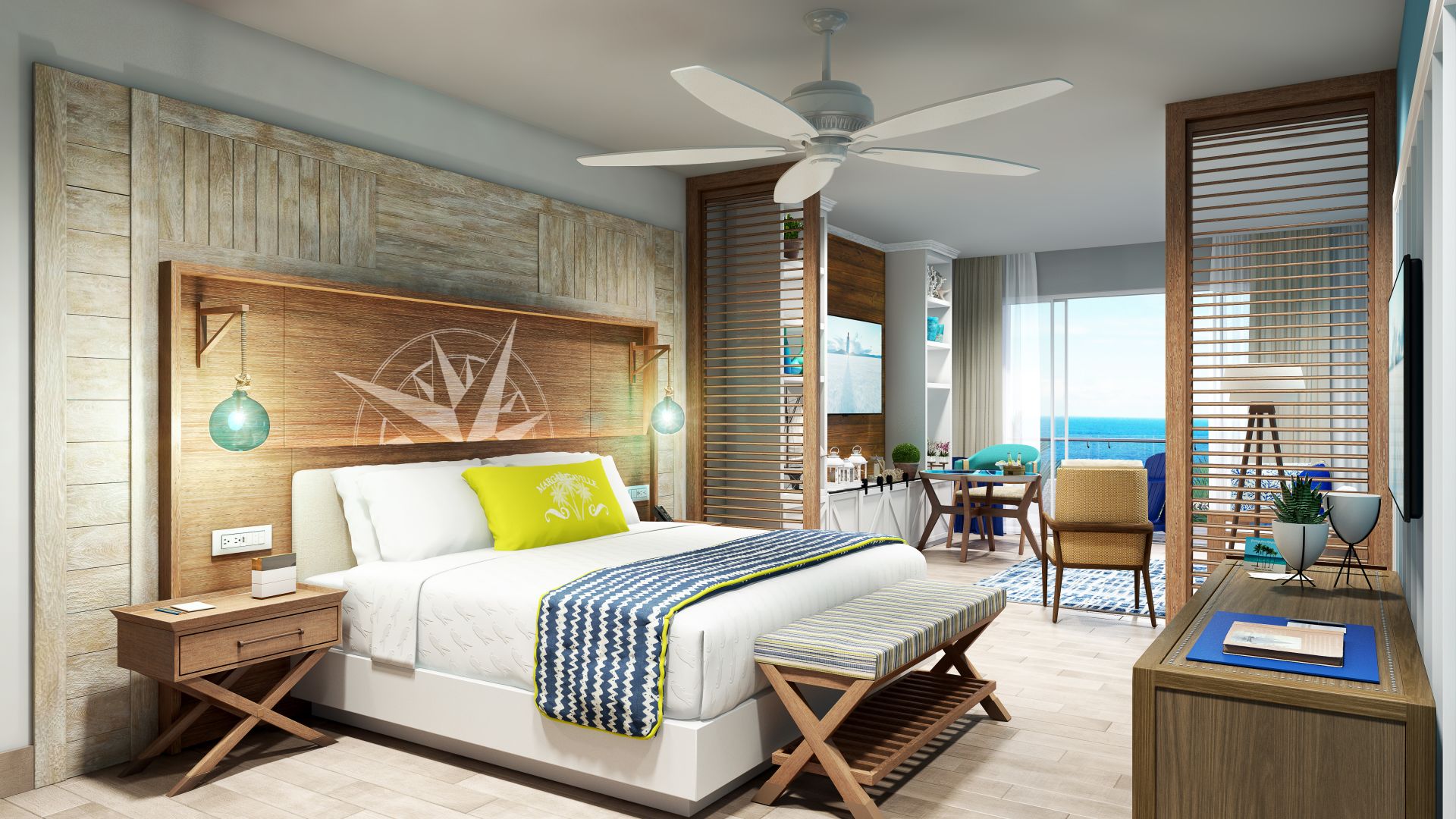 A room at Margaritaville Beach Resort Riviera Maya with a bed and a view of the ocean, perfect for a destify wedding night.