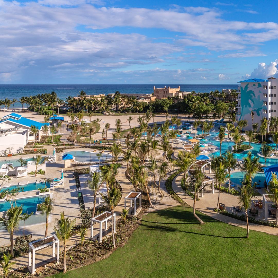 An aerial view of Margaritaville Island Reserve Cap Cana Wave with a pool, beach, and wedding venue.