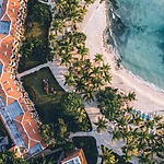 An aerial view of a destify wedding resort on the beach.