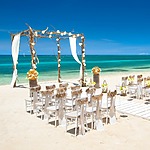 A beach wedding ceremony set up with various packages.