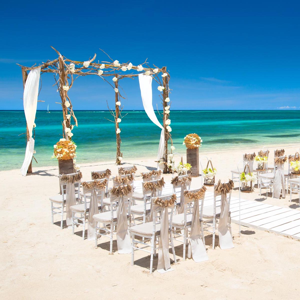 A beach wedding ceremony set up with various packages.