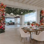 Chic open-air destination wedding space for older couples, with floral columns and lounge area.