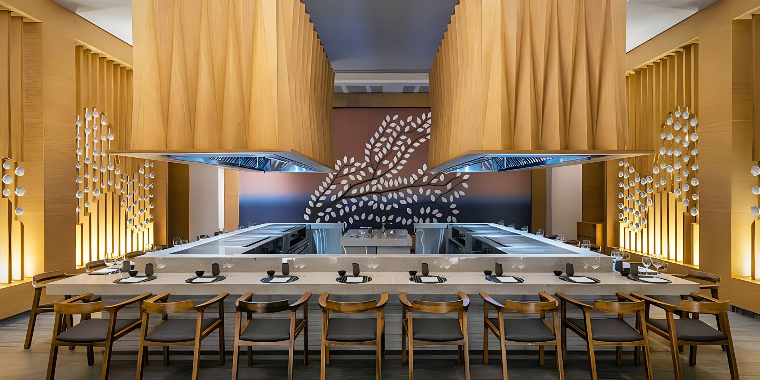 Catalonia Grand Costa Mujeres with a long bar and wooden ceiling.