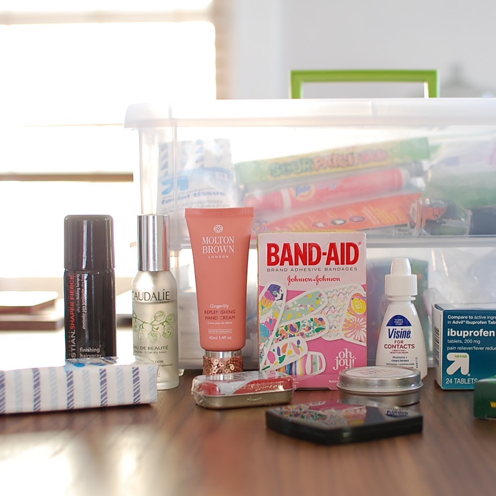 A destination wedding survival kit box of band aids.