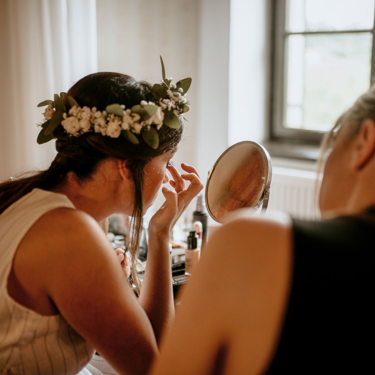 A bride nervously getting ready in front of a mirror, experiencing pre-wedding jitters.