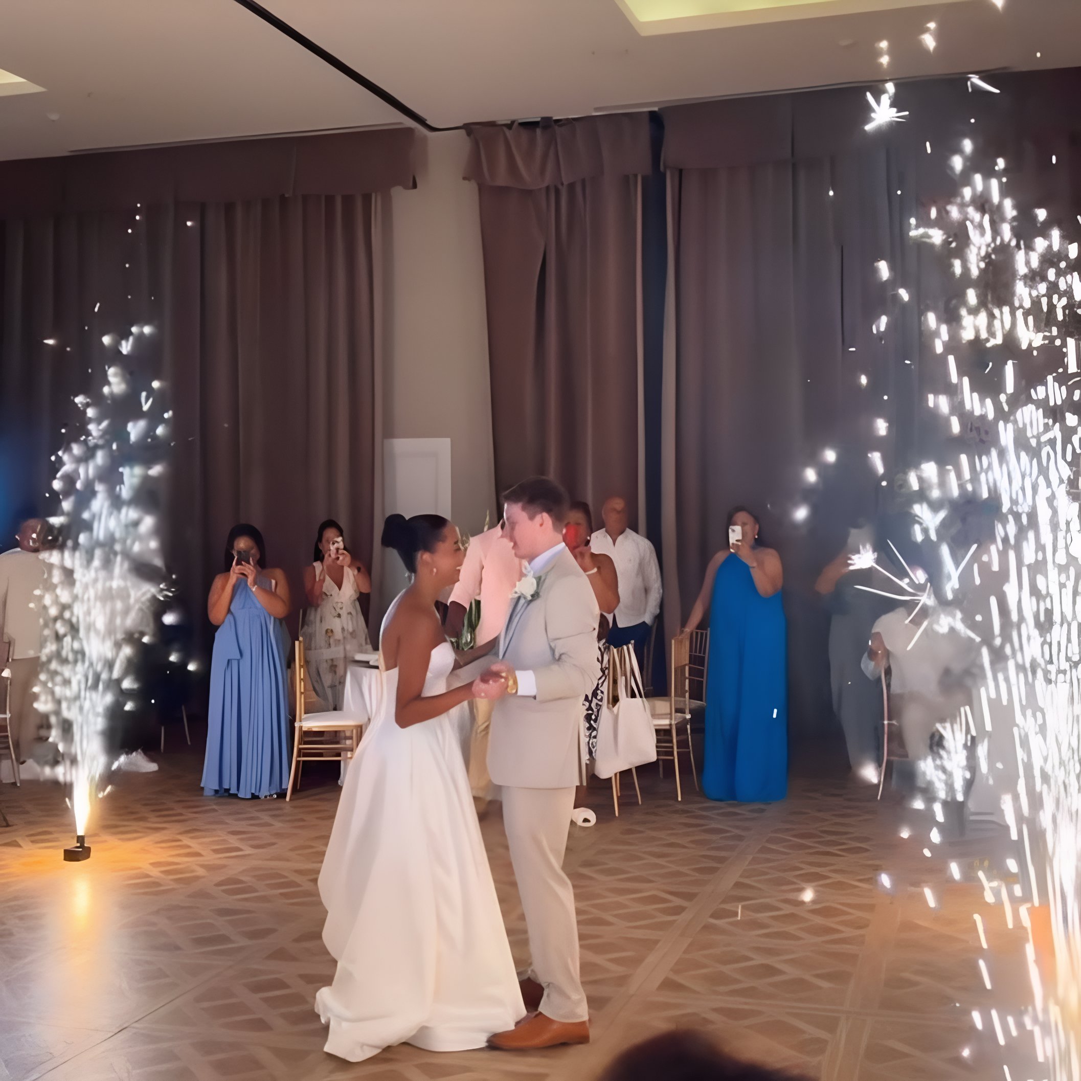 A Kiaralis and Konstantin at Majestic Colonial dance in front of sparklers.