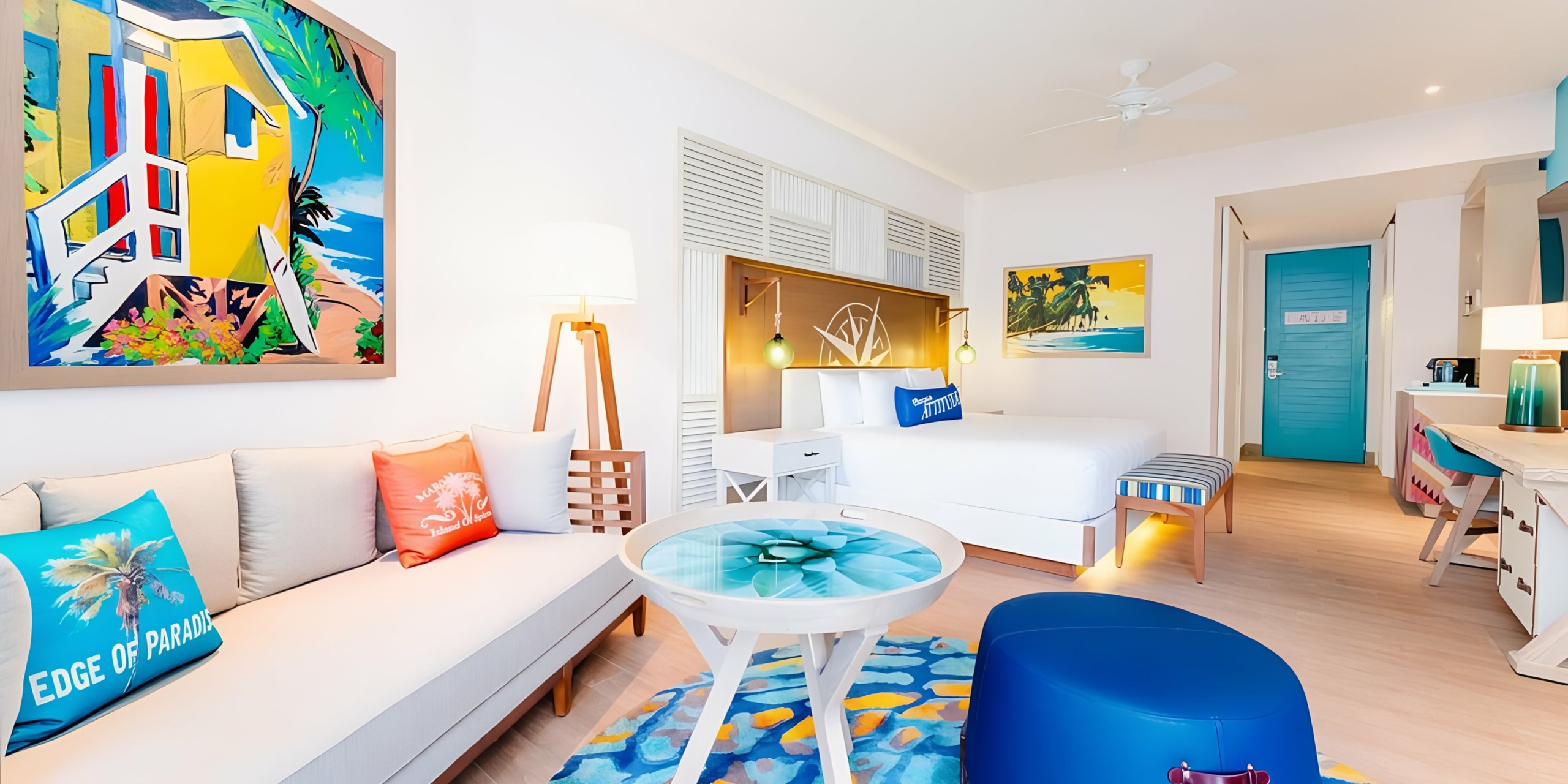 A blue and white room with a Margaritaville Island Reserve Riviera Maya bed and couch.