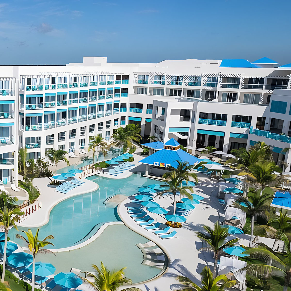 An aerial view of Margaritaville Island Reserve Riviera Maya with a pool and lounge chairs.