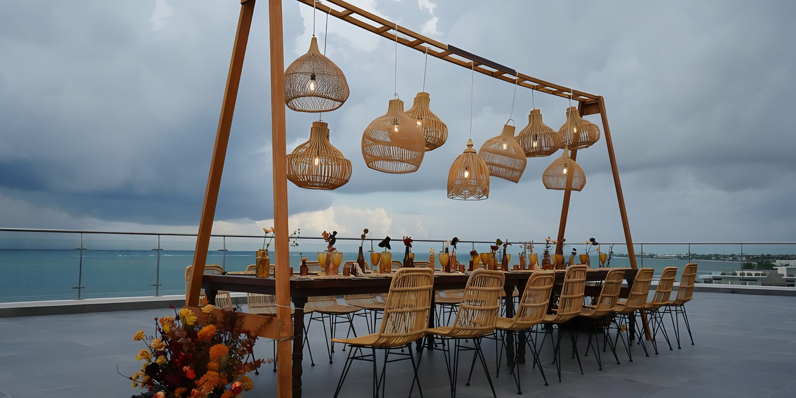 A Margaritaville Island Reserve Riviera Maya set up on a balcony overlooking the ocean.