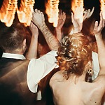 A bride and groom dancing at their wedding reception, showcasing one of the many activities for guests to enjoy.