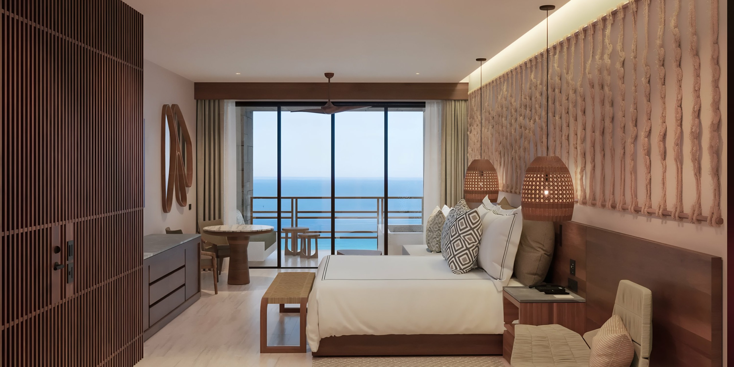 Secrets Playa Blanca Costa Mujeres with a sea view, featuring a large bed, contemporary furniture, and neutral tones.