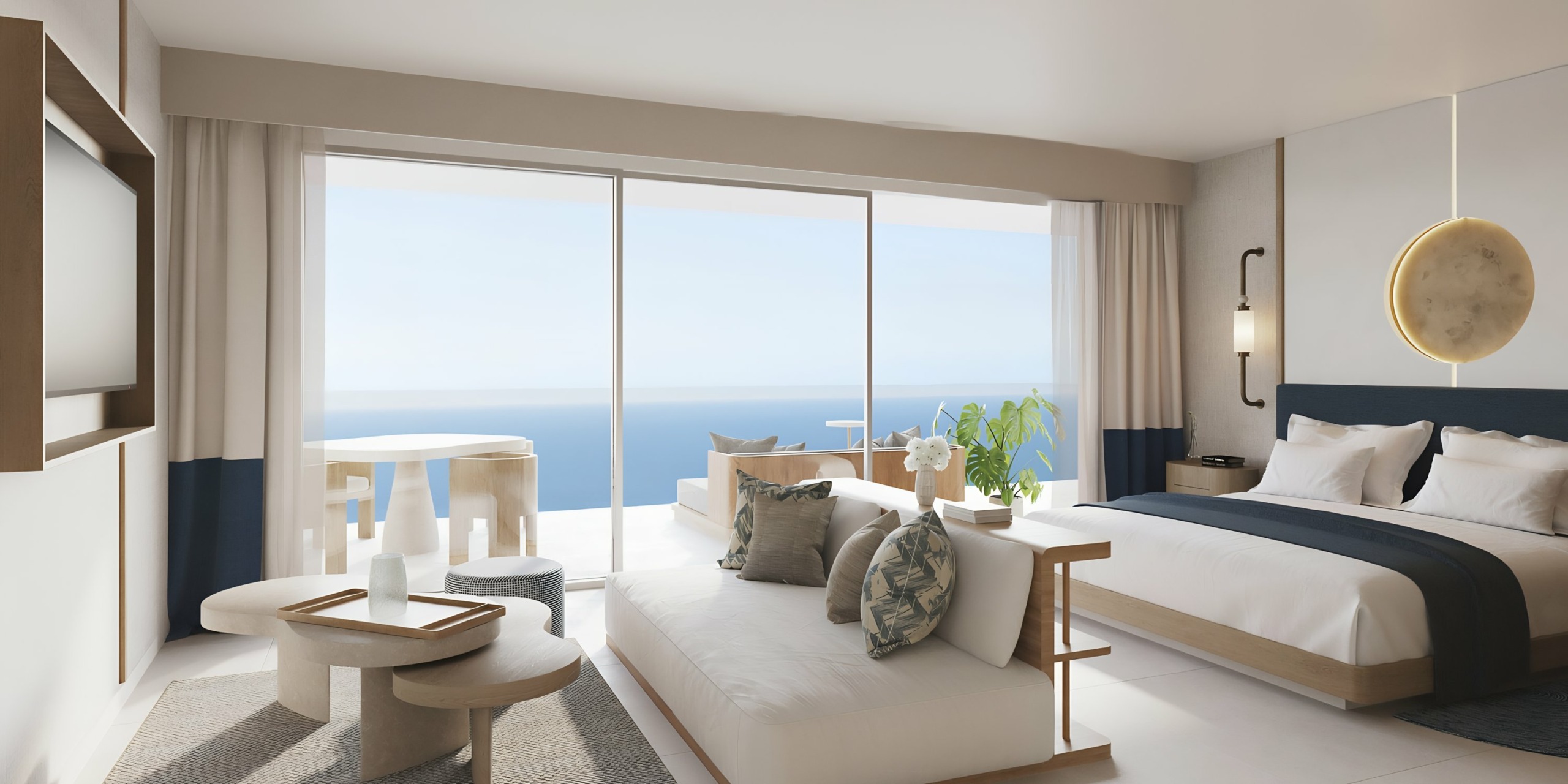 A modern and airy AVA Resort Cancun room with a panoramic ocean view from its floor-to-ceiling windows.