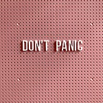 Plastic letters spelling out "don't panic" on a pegboard background, illustrating what not to do the week of your wedding.