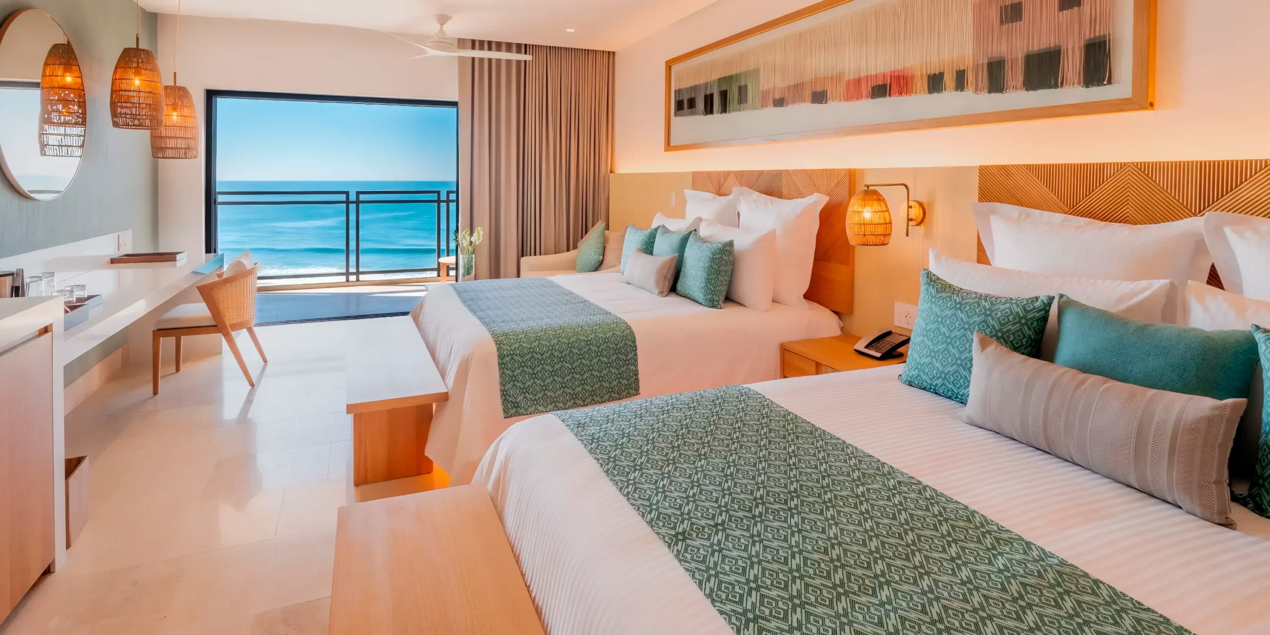 Experience a dreamlike stay at Dreams Estrella del Mar in Mazatlan, where your destination wedding becomes unforgettable. This room features two comfortable beds, an ocean-view balcony, and modern decor to set the perfect scene for your special celebration.