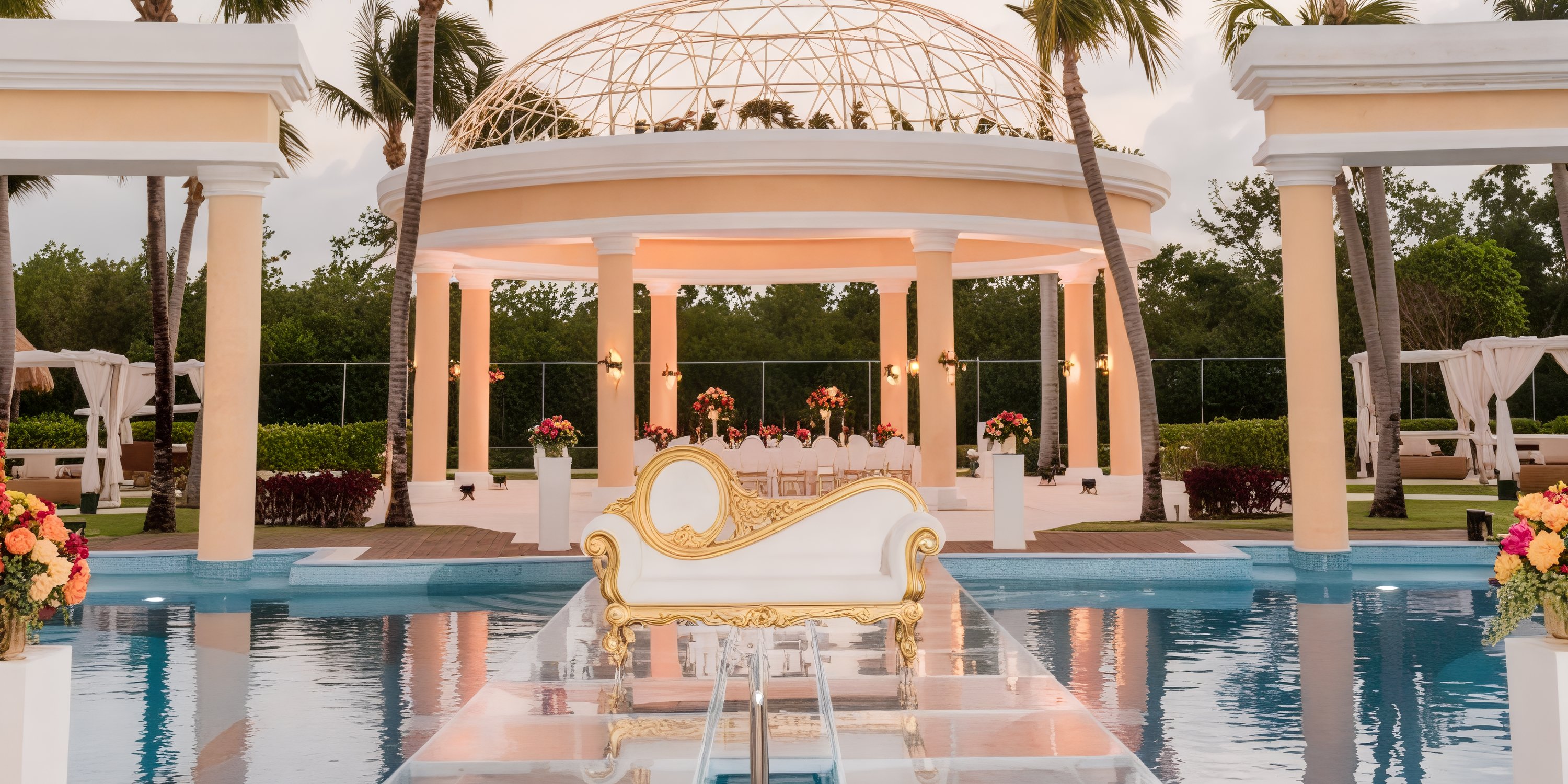 JOIA Paraiso offers an elegant outdoor venue, perfect for a destination wedding, featuring a central chaise longue surrounded by water and flowers.
