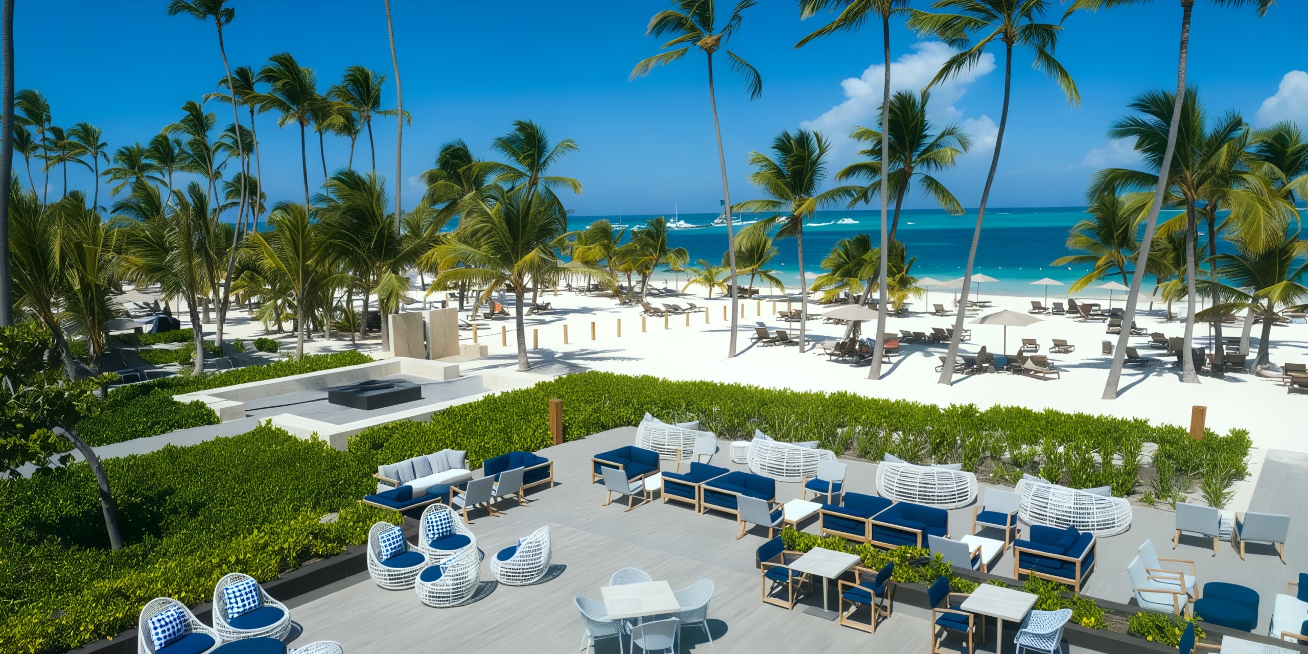 Lopesan Costa Bavaro presents a serene tropical beach scene featuring palm trees, pristine white sand, and stunning turquoise waters. The outdoor seating area highlights an inviting arrangement of white and blue chairs in the foreground.