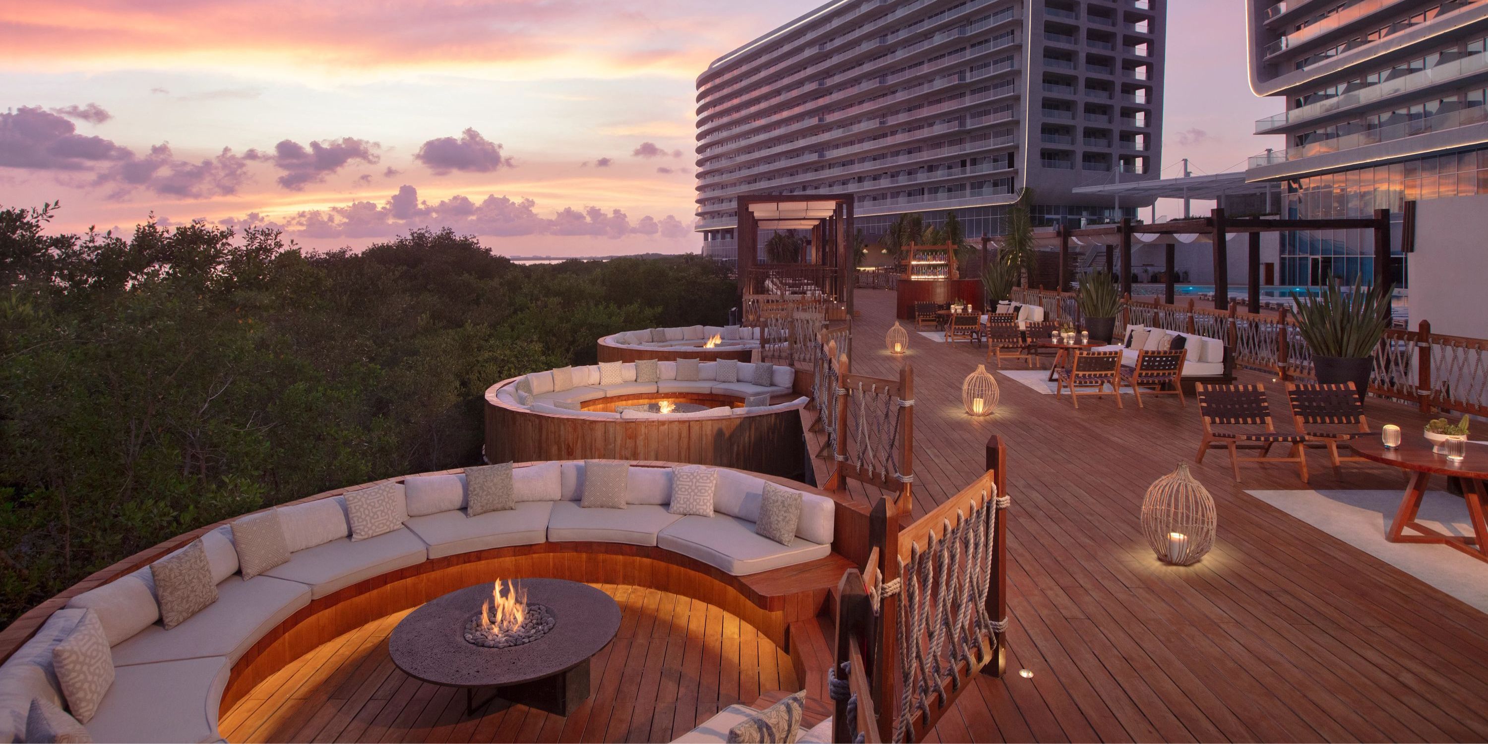 Experience breathtaking sunset views from the seating areas and fire pits on the rooftop terrace at Hyatt Vivid Grand Island, an ideal setting for a destination wedding.