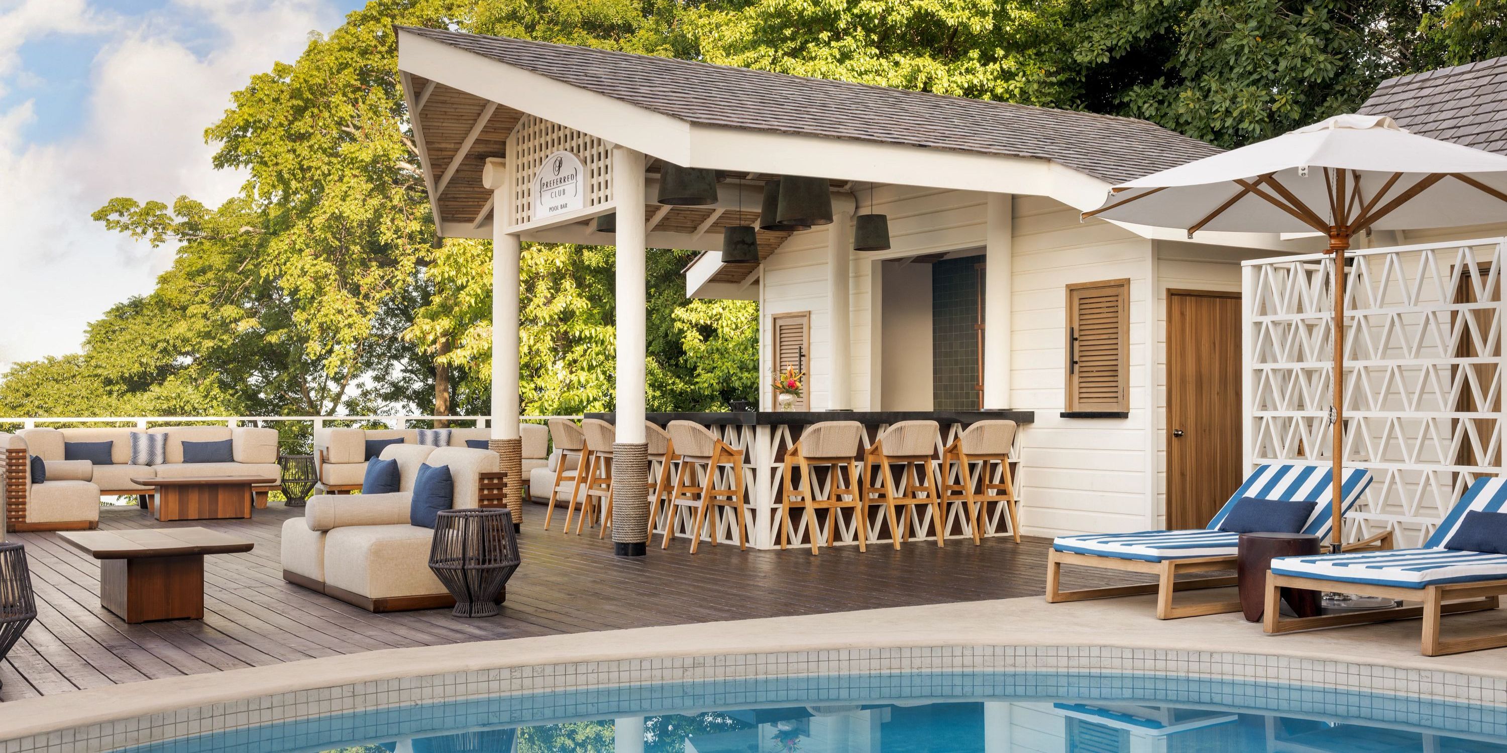 Secrets St Lucia features a poolside lounge with sunbeds and a shaded pavilion, perfect for weddings.