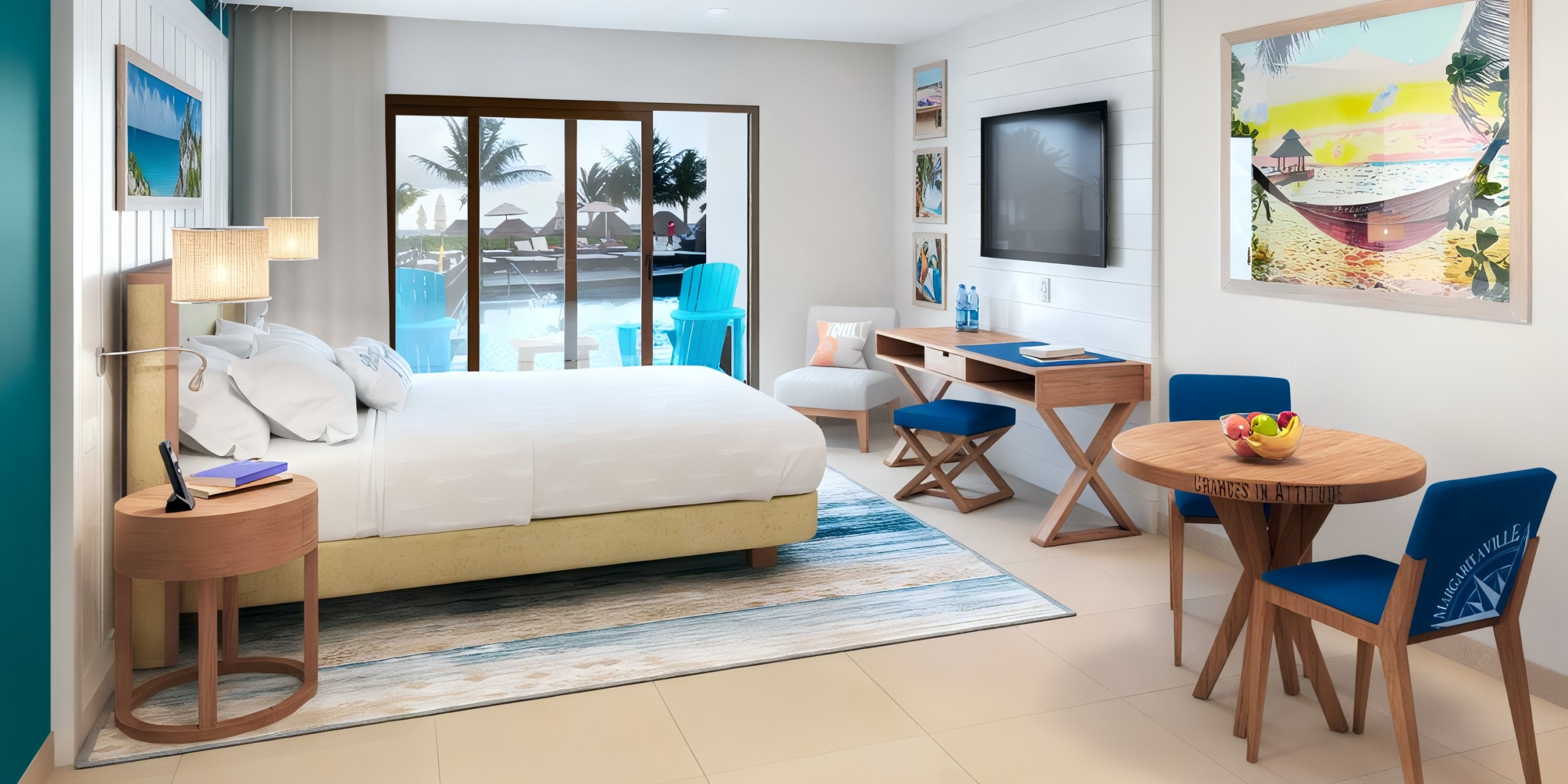 The bright hotel room at Margaritaville Island Reserve Resort Riviera Cancun features a bed, desk, chairs, and a table. A large window overlooks the pool area with palm trees. The decor includes a colorful framed picture on the wall.