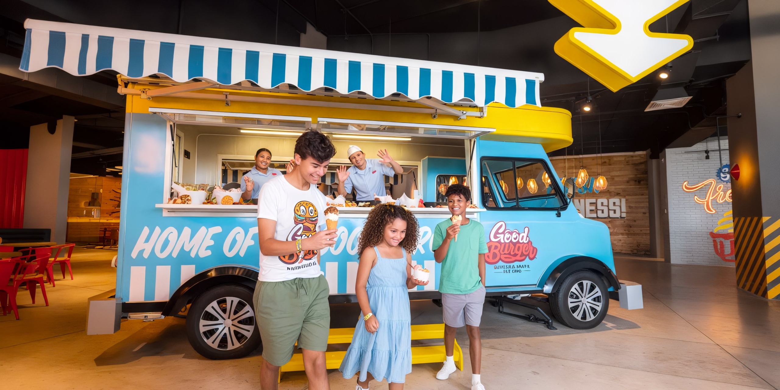 Guests enjoying ice cream near a vibrant food truck at the Nickelodeon Hotels & Resorts Riviera Maya.